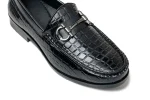 Close up of textured black croco leather lace-up shoes with leather lining