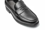 Close up of black leather Wiggins loafers with moccasin stitching, penny strap and saddle overlay