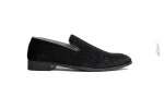 Close up of plush black velvet leather loafers with grosgrain ribbon