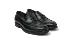 Close up of black leather Wiggins loafers with moccasin stitching, penny strap and saddle overlay