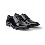 Black leather oxfords with a high shine finish, matching black laces, and an elegant wingtip design.