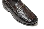 Close up of textured brown croco leather shoes with leather lining