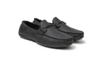 Close up of supple black leather loafers with moccasin toe stitching