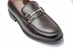 Close-up photo of supple hand-burnished brown leather slip-on loafers for men