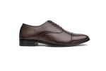 Close up of classic brown leather oxford shoes with lace-up detailing