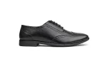 Close up of black leather brogue shoes with perforated detailing and black laces