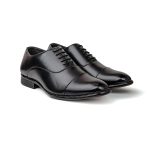 Close up of black leather oxford dress shoes with minimalist cap toe detailing