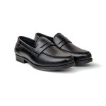 Close up of black leather loafers with moccasin stitching and penny keeper straps