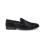 Black leather loafers with complicated gold embroidery elaborations on the toes and heels.