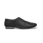 Black slip-on shoes covered completely in small black sequins that reflect light.