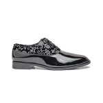 The black leather-based slip-on footwear have white floral embroidery on the toes and heels.
